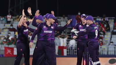 Scotland's players celebrate the dismissal of Oman's batsman Jatinder Singh. AP