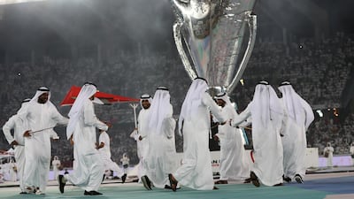Men perform during the opening ceremony. AP Photo