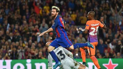 Lionel Messi scores his and Barcelona's third goal during the 4-0 victory over Manchester City. Shaun Botterill / Getty Images
