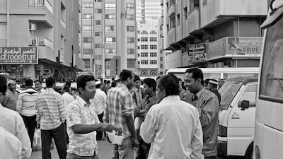 Workers gather in downtown Abu Dhabi. Courtesy Yasser Elsheshtawy