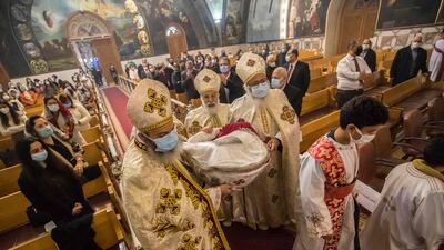 Priests lead Christmas Mass at the Archangel Michael Coptic Orthodox Church. The origin of the word “Coptic” is Aeygyptus – the Greek word for Egypt. AFP