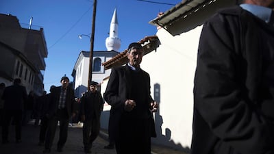 Pilgrims walk outside Kirmahalle Cammi mosque in the north-eastern Greek town of Komotini. AP Photo