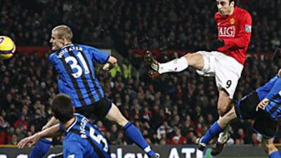 Dimitar Berbatov, right, fires home the winner.