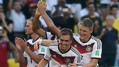 Philipp Lahm, left, celebrates with Bastian Schweinsteiger, right, after Germany's win over France in the 2014 World Cup quarter-finals on Friday. Pedro Ugarte / AFP / July 4, 2014
