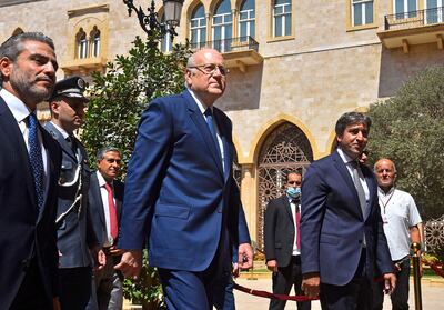 Lebanon's Prime Minister Najib Mikati (C) arrives at the Grand Serial in Beirut. Dalati / AFP