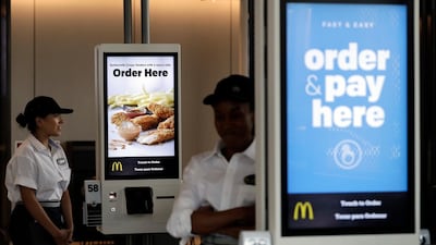 FILE - In this Aug. 8, 2018, file photo employees stand in McDonald's Chicago flagship restaurant. McDonald's Corp. reports financial results Tuesday, April 30, 2019. (AP Photo/Nam Y. Huh, File)