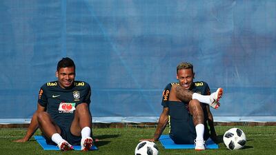 Casemiro, left, wants Brazil not to solely rely on Neymar for inspiration when Brazil take on Mexico in the second round on Monday. Hannah McKay / Reuters