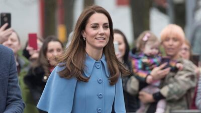 The Duchess of Cambridge wears a powder blue Mulberry coat for her second day in Northern Ireland. The coat was worn with Rupert Sanderson Malory pumps, a Jimmy Choo clutch and diamond and sapphire earrings. Reuters