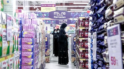 A woman checks out a Ramadan promotional stand at Carrefour in Yas Mall, Abu Dhabi. Victor Besa / The National