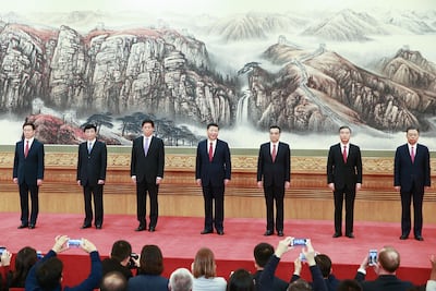 The members of China's newly revamped Politburo Standing Committee, Han Zheng, Wang Huning, Li Zhanshu, Xi Jinping, Li Keqiang, Wang Yang and Zhao Leji, attend a "greet the media" at the Great Hall of the People on October 25, 2017 in Beijing. Lintao Zhang / Getty Images