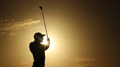 Danish golfer Rasmus Hojgaard is silhouetted against a low sun as he plays a shot during day two of the Abu Dhabi HSBC Championship, at Yas Links Golf Course in Abu Dhabi. He finished the round two under par. Getty Images