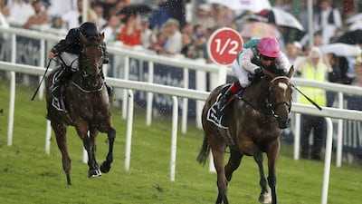 Enable, ridden by jockey Frankie Dettori, wins the English Oaks at Epsom Racecourse. Adam Davy / PA