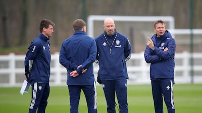 New Leeds manager Jesse Marsch, right, assistant manager Cameron Toshack, second right, and coach Franz Schiemer, left, during a training session. PA