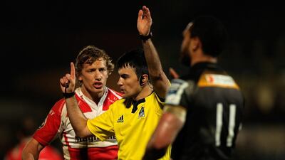 Referees such as Marius Mitrea, centre, pictured speaking to Billy Twelvetrees of Gloucester during a European Challenge Cup quarter-final match against London Wasps on April 6, 2014 in High Wycombe, England, are paid to enforce the rules and not maintain the spectacle of a match. Ben Hoskins / Getty Images