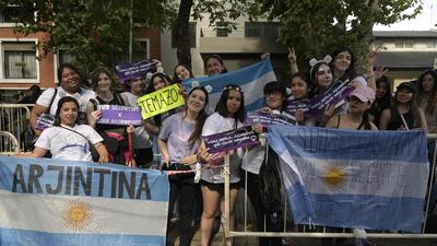Argentinian fans of Jin pose with a flag made specifically for him.
