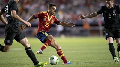 Jesus Navas, centre, will join Fernandinho at Manchester City for next season. Don Emmert / AFP