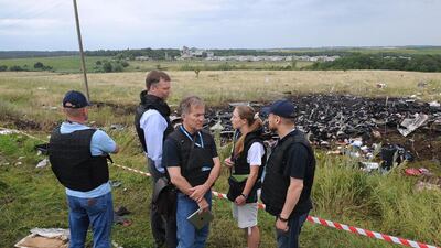 Members of the Organization for Cooperation and Security in Europe’s special monitoring mission to Ukraine wait to visit the site of the crash of Malaysian Airlines flight MH17 in east Ukraine. Dominique Faget / AFP / July 18, 2014