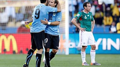 Luis Suarez, left, and Diego Forlan have combined well for Uruguay in the World Cup.
