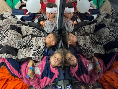 Palestinian children wounded in an Israeli strike receive treatment at a hospital in Rafah on February 12. Reuters