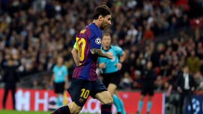 Barcelona forward Lionel Messi scores his side's fourth goal . AP Photo/Kirsty Wigglesworth
