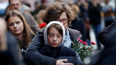 People mourn outside the synagogue in Halle, Germany after two people were killed in a shooting. Reuters
