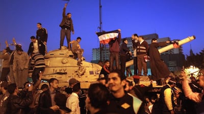 Demonstrators celebrate the news of the resignation of Hosni Mubarak in Cairo in 2011. John Moore / Getty Images / April 2014
