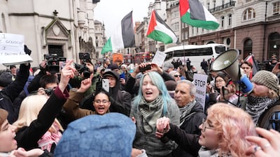 Protesters celebrate outside the High Court in central London after Palestine Action won a challenge over its ban in the UK as a terror group. PA