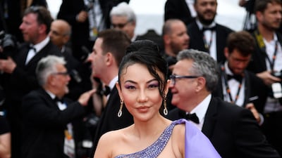 Chinese-American socialite Jessica Wang wears a purple and gold, caped Tony Ward to a screening of 'Forever Young (Les Amandiers)' on May 22. Getty Images