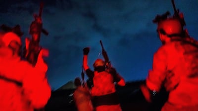 After the stroke of midnight, Taliban fighters from the Fateh Zwak unit storm into Hamid Karzai International Airport, wearing American-made uniforms and brandishing American M4 and M16 rifles and riding US pick-up trucks on August 31, 2021. By Marcus Yam. Los Angeles Times/EPA