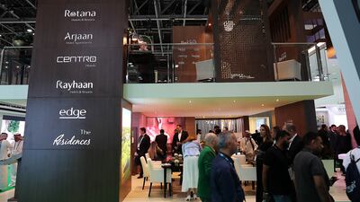 Visitors at the Rotana stand on the third day of the Arabian Travel Market held at the Dubai World Trade Centre. Pawan Singh / The National