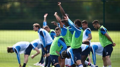 Jack Wilshere of Arsenal stretches during a training session ahead of the FA Cup final on Wednesday. Clive Mason / Getty Images / May 14, 2014