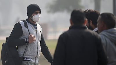 Out and about with a mask in New Delhi last month. AFP