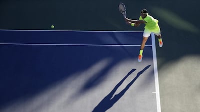 Jack Sock, of the United States, returns a shot to Taylor Fritz, also from the US, during the first round of the US Open tennis tournament in New York. Julio Cortez / AP Photo