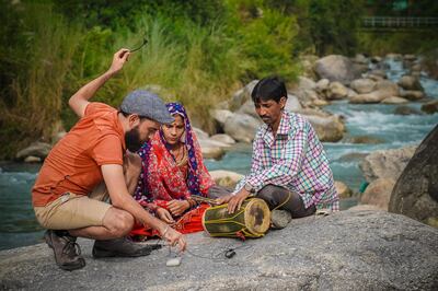 Gael Hedding, left, setting up the BackPack Studio for Dholru folk performers.