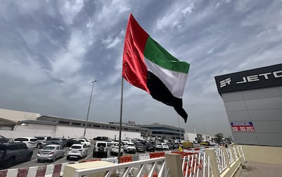 The UAE flag is being flown with pride across various locations as part of a campaign to celebrate the country. Chris Whiteoak / The National