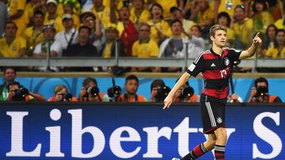 Germany forward Thomas Muller celebrates a goal during the 2014 World Cup semi-final match against Brazil at The Mineirao Stadium in Belo Horizonte on July 8, 2014. Patrik Stollarz / AFP