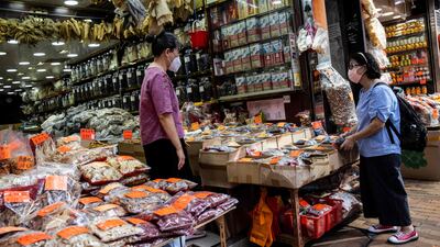 A woman visits a shop that sells sharks fin, dried seafood and other products in Hong Kong. AFP
