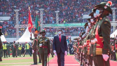 Newly elected Zambian President Hakainde Hichilema inspects the guard of honour during his inauguration at the Heroes Stadium in Lusaka. The country owes money to different multilateral lending agencies. Salim Dawood / AFP