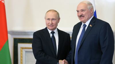 Russian President Vladimir Putin, left, shakes hands with Belarusian President Alexander Lukashenko in the Konstantinovsky Palace in St Petersburg, Russia, on June 25. EPA