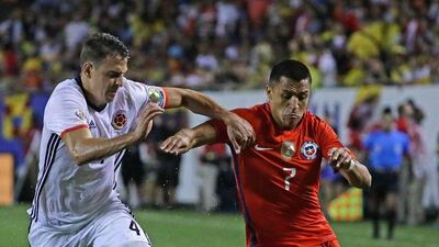 Santiago Arias #4 of Colombia and Alexis Sanchez #7 of Chile chase the ball during a semi-final match in the 2016 Copa America Centernario at Soldier Field on June 22, 2016 in Chicago, Illinois. Chile defeated Colombia 2-0. Jonathan Daniel/Getty Images/AFP