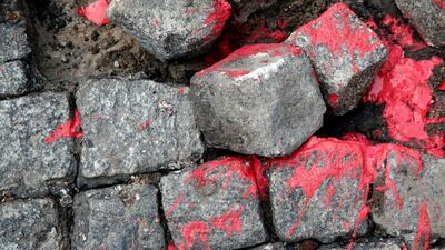 Cobblestones were thrown by masked protesters during clashes with French riot police. REUTERS/Philippe Wojazer
