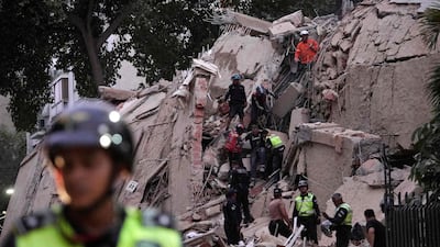 Rescue workers evacuate an injured person in Caracas. AFP