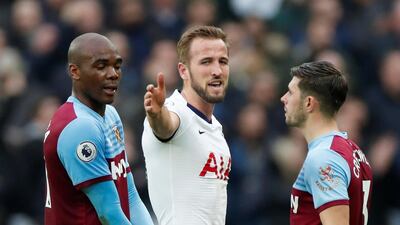 Tottenham Hotspur's Harry Kane speaks with West Ham United's Aaron Cresswell and Angelo Ogbonna. Reuters