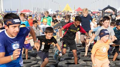 Kids compete and enjoy the obstacles and challenges on the Mini Mudder course.
