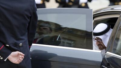 Sheikh Mohammed bin Zayed leaves his car upon his arrival for a meeting with the French President at the Elysee presidential palace. Alain Jocard / AFP Photo