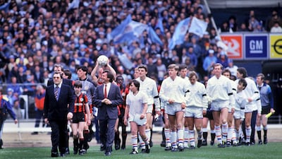 The Chelsea and Manchester City players enter the field for the 1986 Full Members Cup. Colorsport