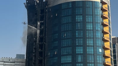 About 150 people were evacuated after a fire ripped through a portion of the residential Saleh Bin Lahej building near Dubai's Mall of the Emirates on Tuesday. Photo: The National