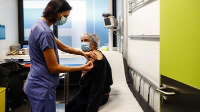 A nurse administers a dose of the Pfizer-BioNTech Covid-19 vaccine at the Hotel-Dieu hospital in Paris. AFP