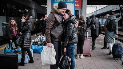 Ihor welcomes Lyudmila, who has returned from neighboring Poland, at Kyev-Pasazhyrsky train station. AFP