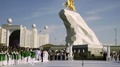 People gather for the monument unveiling ceremony in Ashgabat on May 25. Alexander Vershinin/AP